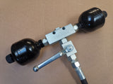 Front loader vibration dampening with two membrane accumulators and shut-off valve